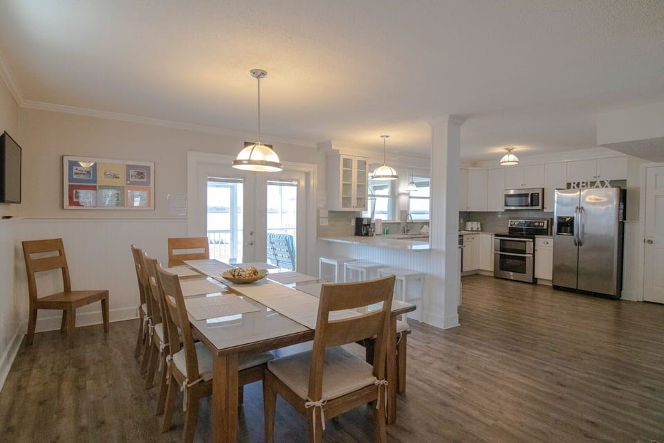 Large dining table and kitchen