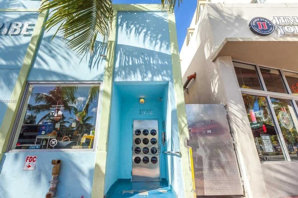 Welcome to your short-term stay! 🌴 Step through our unique porthole door into a bright, cozy getaway located right in the heart of the action. Your South Beach adventure starts at this iconic blue entrance.
