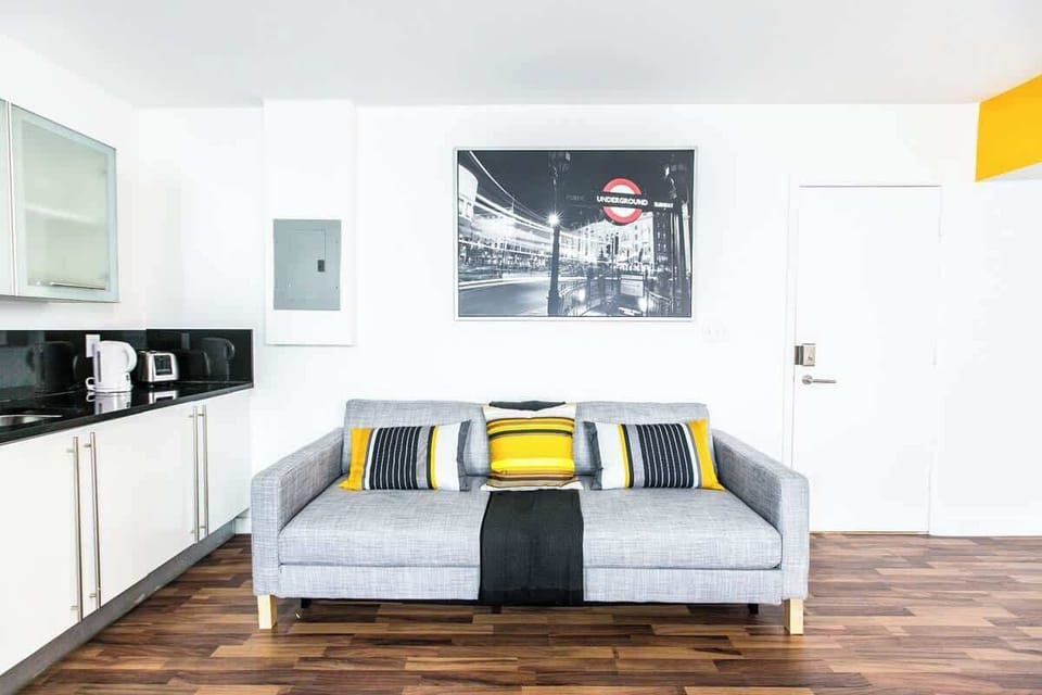 this cozy living space features bold colors, modern furniture, and natural light.