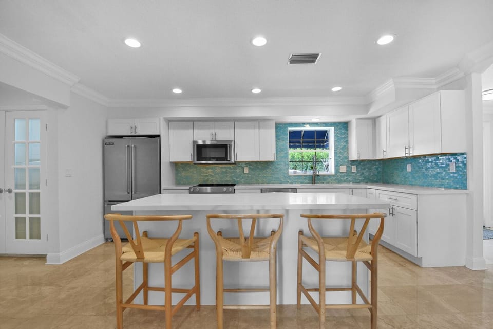 This breakfast bar seats 3
The kitchen can provide for many more, with all cooking utensils provided for your use