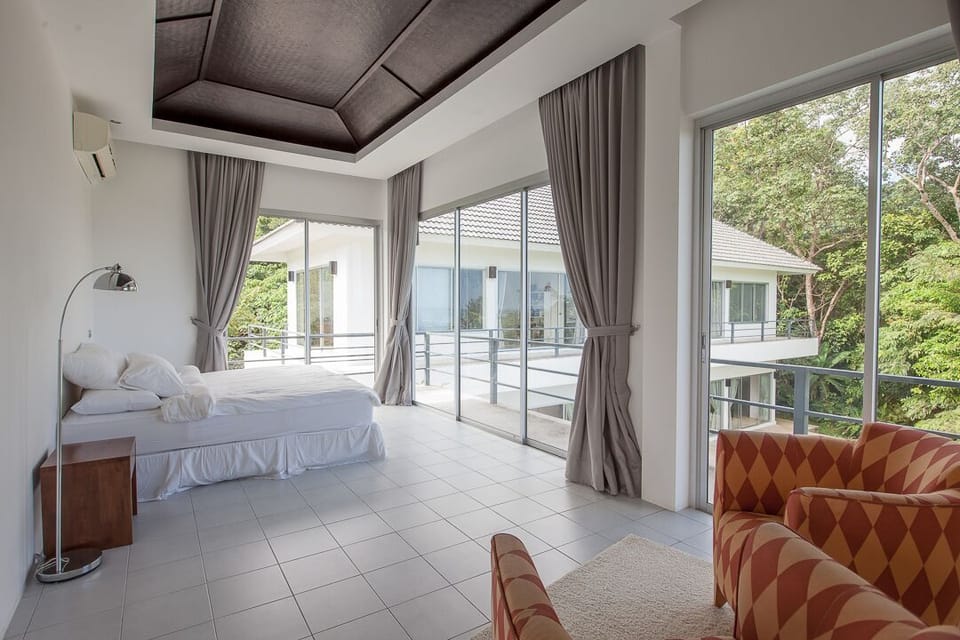 The second bedroom has a plush queen-sized bed and beautiful ocean views. 