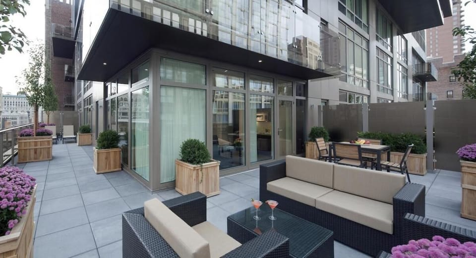 Gather outside for relaxed chats among planters and soft seating.