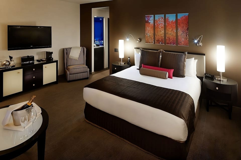 Settle in for a restful night in this spacious bedroom.