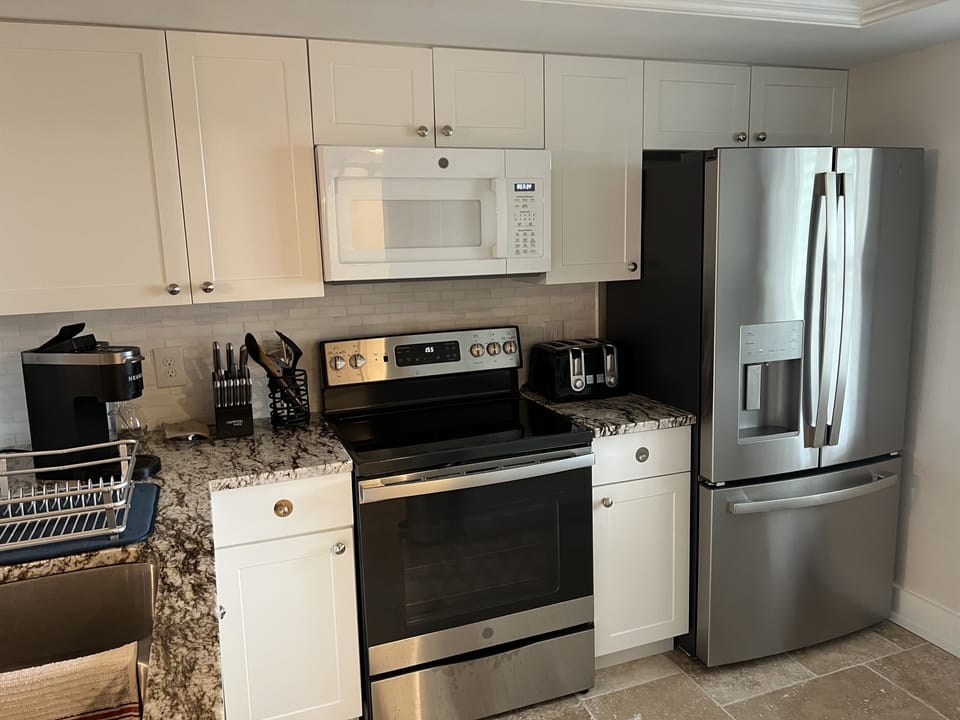 Brand new kitchen cabinets, granite and stainless frig & stove.