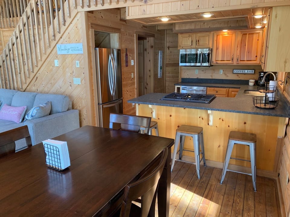 Seating includes an extendable table that seats six, plus a breakfast bar.