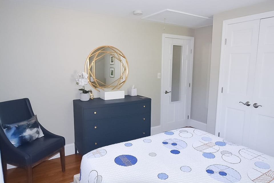 smaller of the two bedrooms, full length mirror