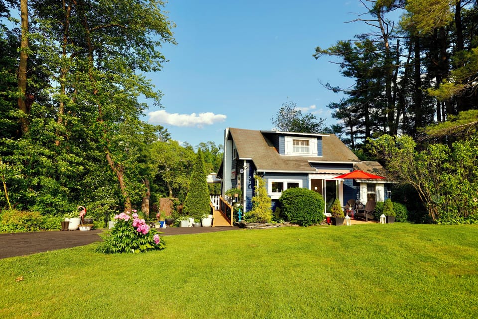 1 acre of property with the Esopus Creek in the back and a farm in the front