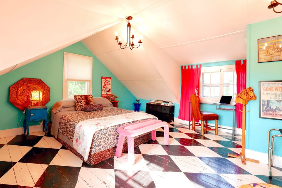 Loft bedroom overlooking creek in back and farm in front.