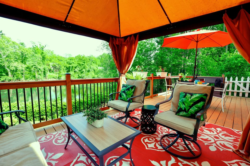 Huge back deck overlooking the creek perfect for relaxing and entertaining.