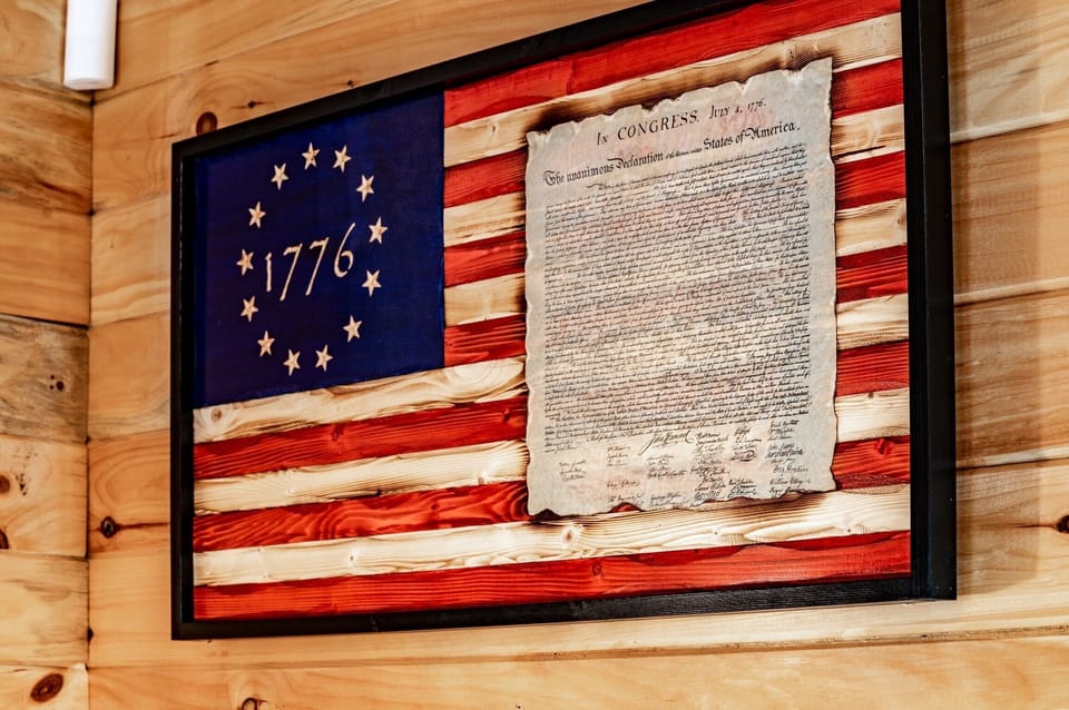 The Declaration of Independence is proudly displayed on the cabin wall.