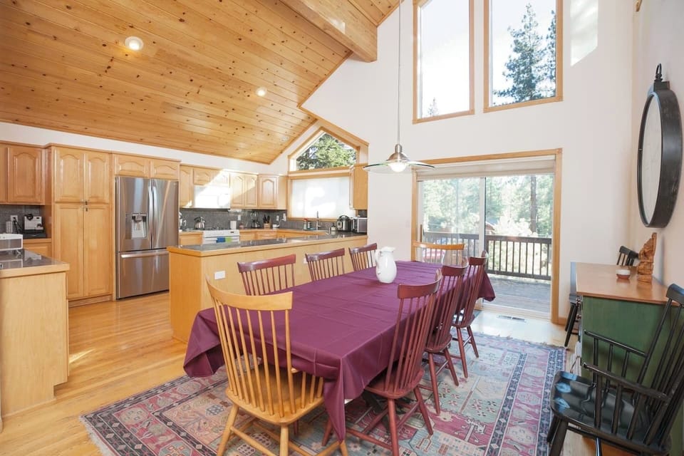 Look at those windows! Lots of natural light in the kitchen and dining space. The table can seat up to 10. 