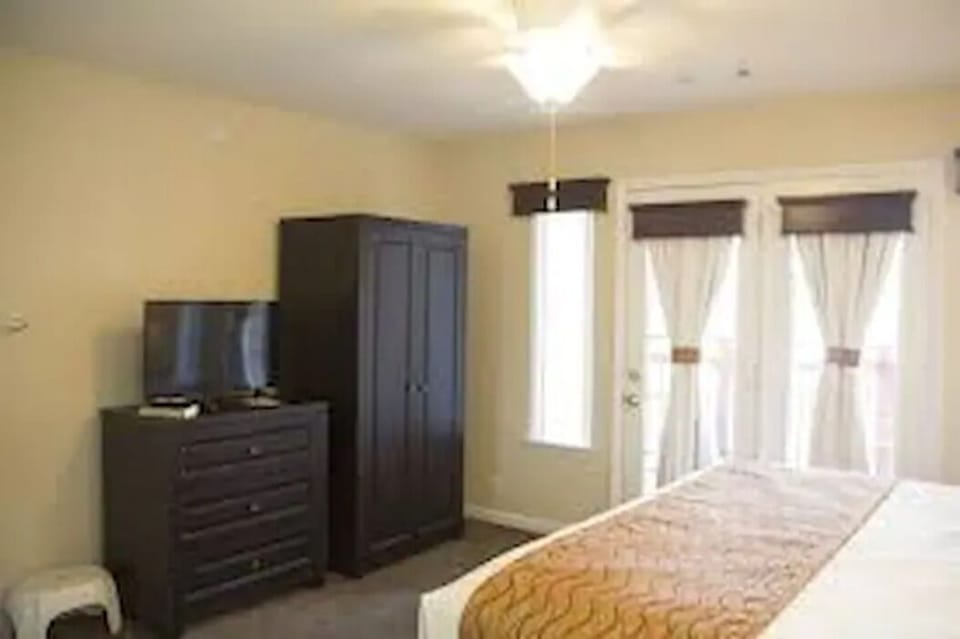 French doors open to a large patio off the master bedroom.
