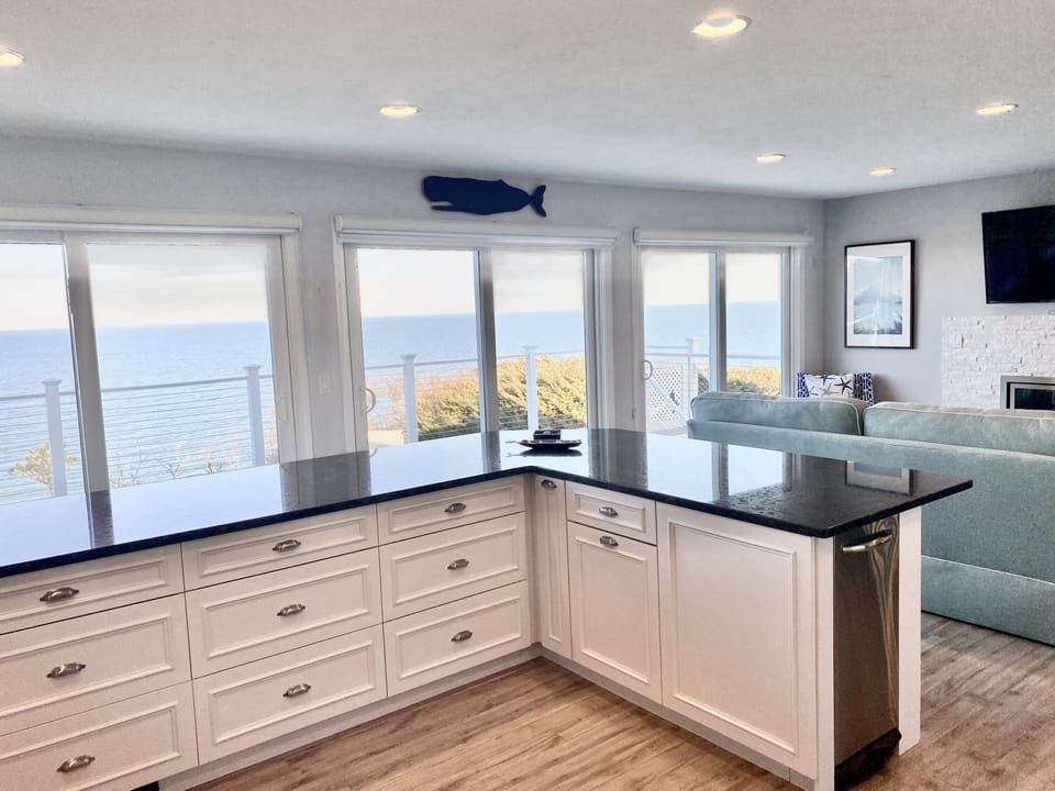 View of Ocean through the kitchen! 3 sliders to deck. Storage galore!