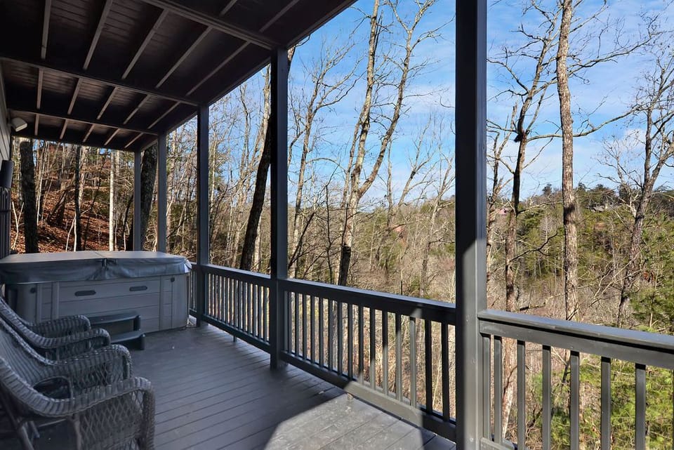 Warm up in the deck hot tub as bare winter branches open onto distant ridgelines. You'll watch the season change while the water steams around you.