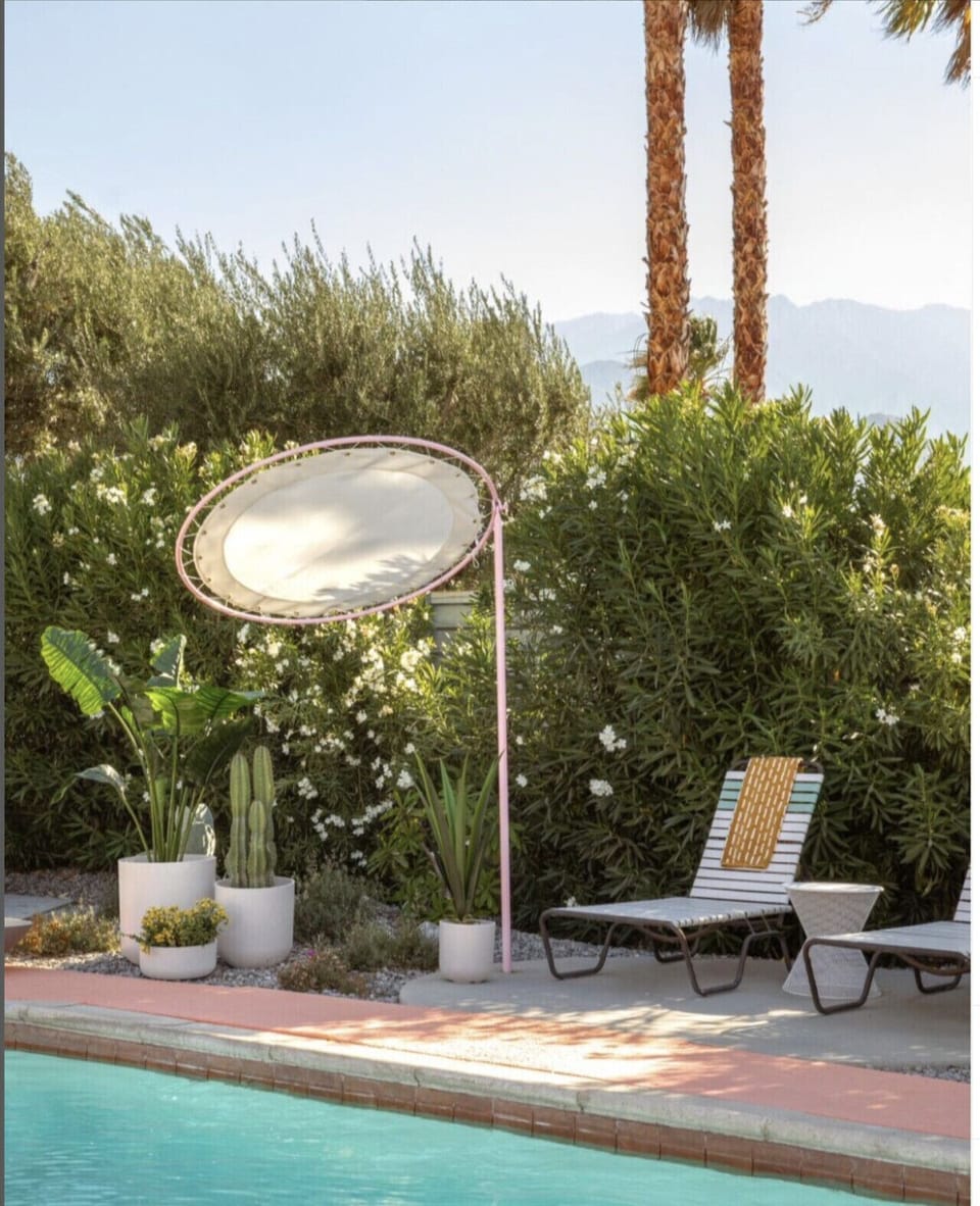 Lounge in style by the pool with desert blooms, mountain views, and chic retro sunbeds 🌴☀️ The perfect spot to unwind and soak up the sun. #PalmSpringsVibes #PoolsideChic #DesertRetreat