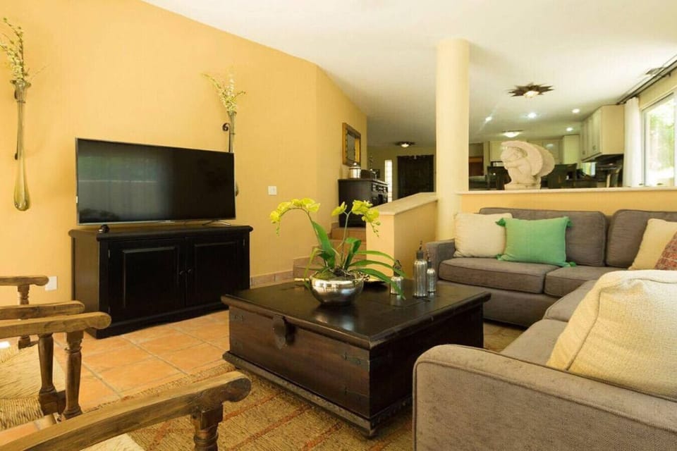Relax in comfort with a sectional sofabed and Smart TV in this inviting living room.