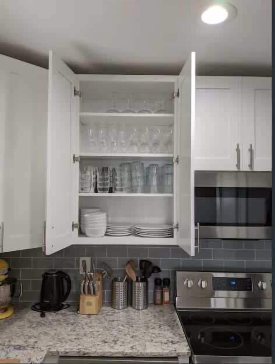 The kitchen is stocked with glasses and dishes for your stay.