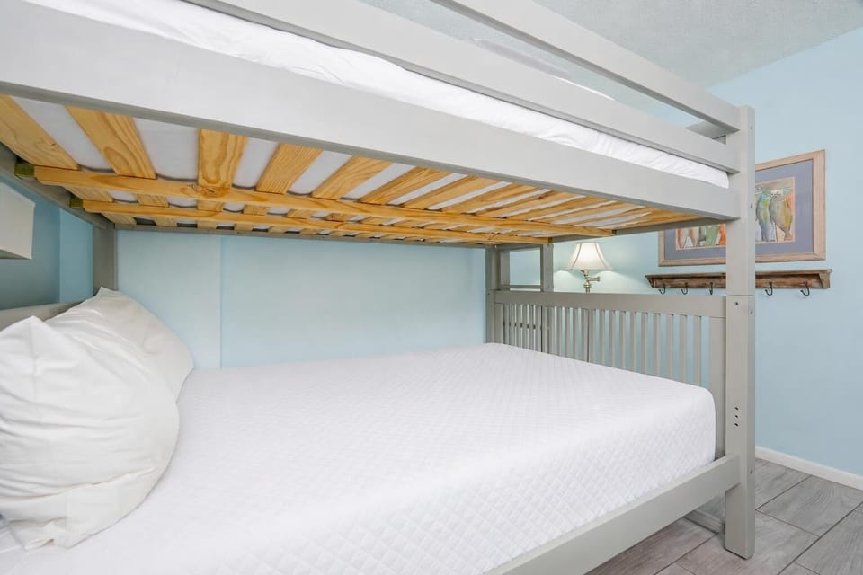 Cozy guest room with queen bunk beds, creating the perfect spot for bedtime stories and restful nights