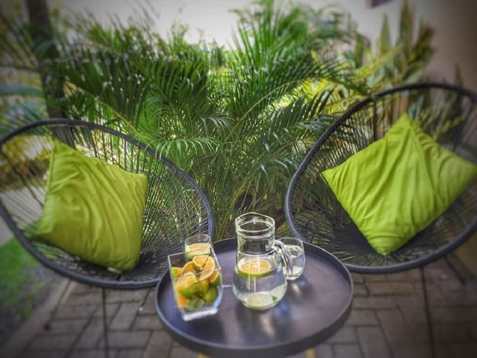 The back patio is covered and features a private grill and Acapulco chairs. 