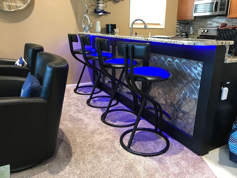 Kitchen area with breakfast bar. 