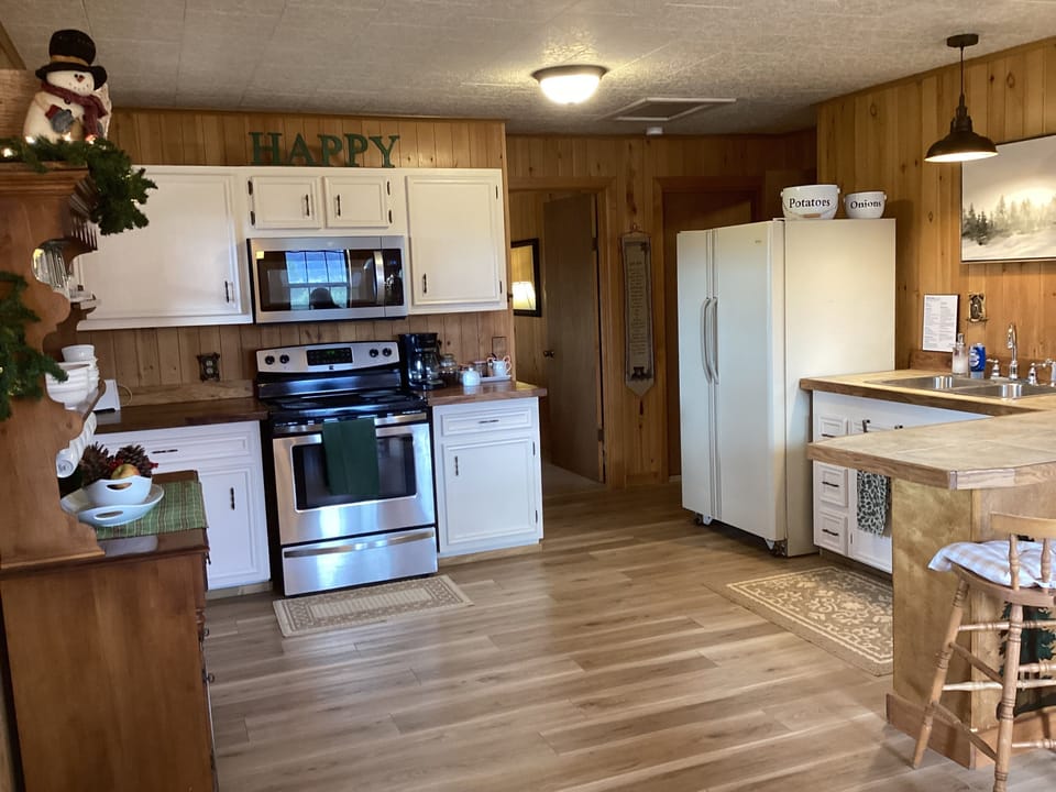 Large, fully stocked kitchen. New microwave and butcher block countertops