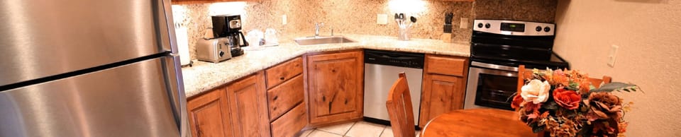 Panoramic view of stocked kitchen 