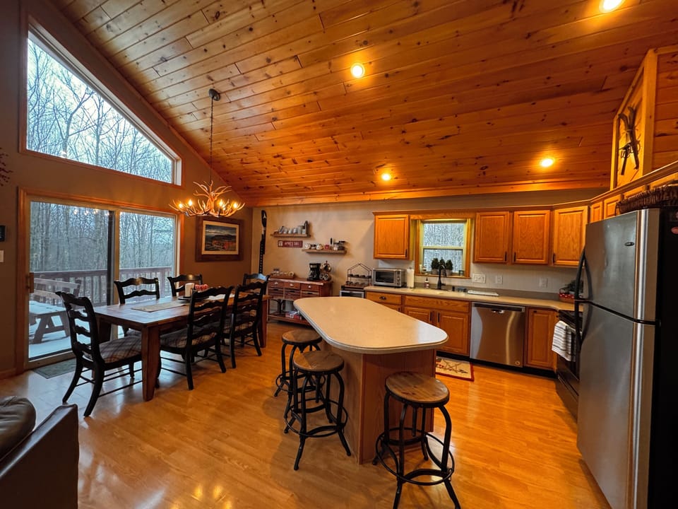Open concept kitchen/dining/living room. One of two living spaces