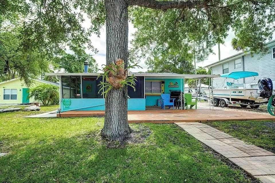 A view of the house screen enclosed patio from the river