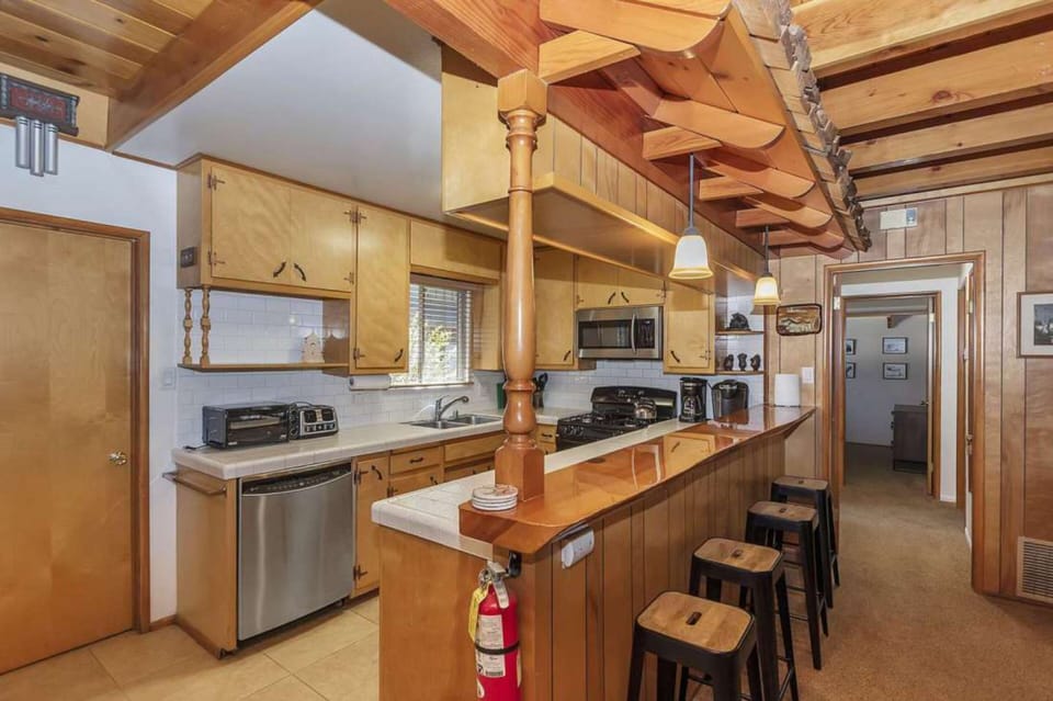 Kitchen features a breakfast bar.
