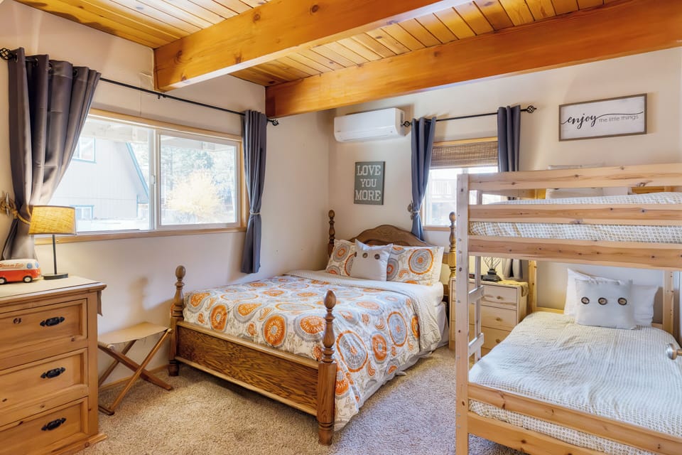 Bedroom 4 features a queen bed and a twin bunk bed.