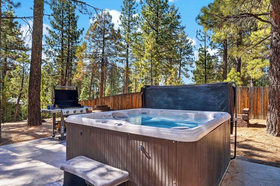 Soak in the private hot tub surrounded by towering pines and fresh mountain air.