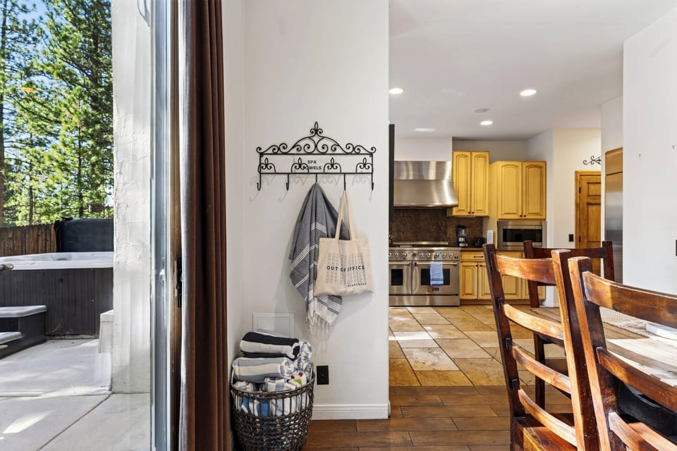 Indoor-outdoor living makes it easy to move from the kitchen and dining area to the hot tub patio.