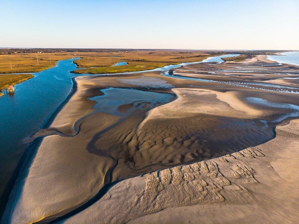 Aerial view of tidal estuary with winding channels