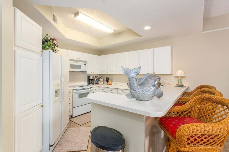 Saint Simons Grand #107 Kitchen with French Door Refrigerator, Electric Stove, and Over-the-Range Microwave