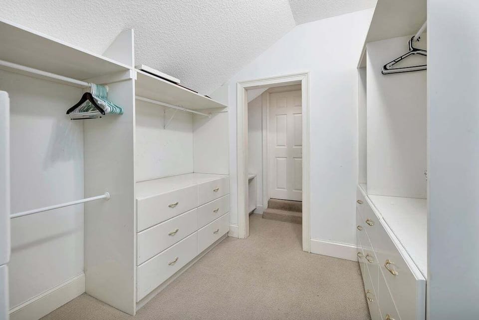 607 Neptune Way - Primary Closet walks through to the Guest Bedroom
