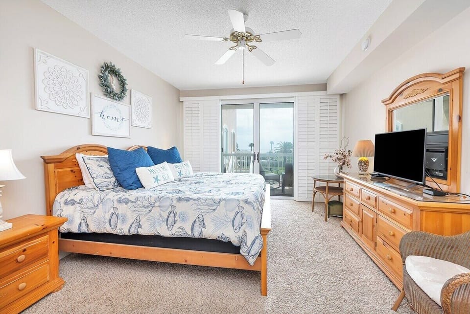 Saint Simons Grand #112 Primary King Bedroom with Ceiling Fan and Balcony Access