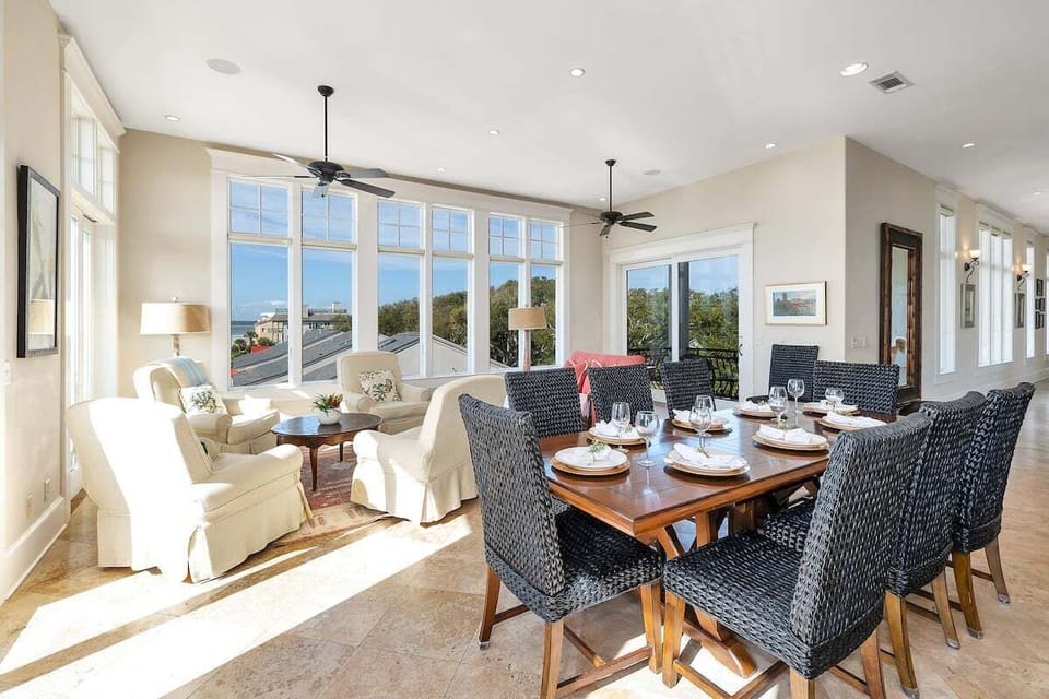Dining area with large windows and ocean views beyond