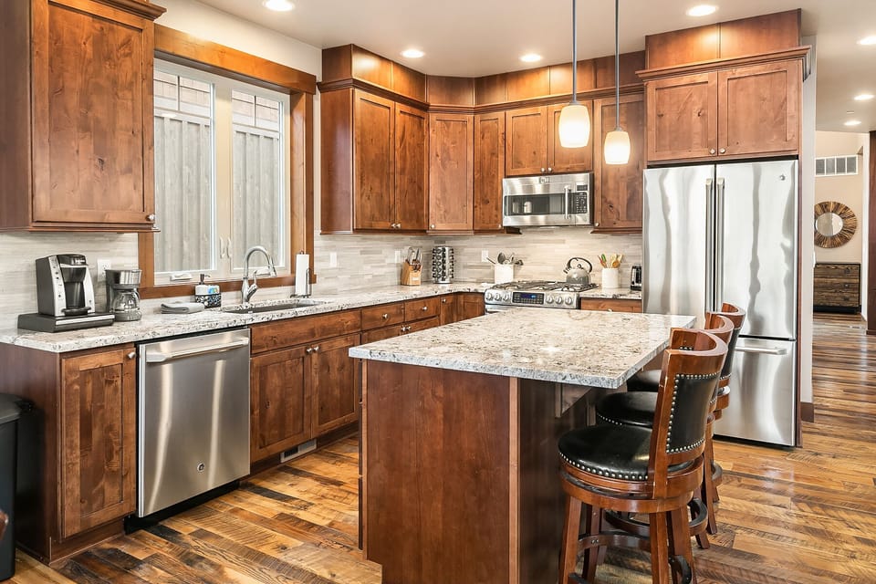 Latitude Adjustment: - Fully stocked chef's kitchen with a large center island and seating for 3.