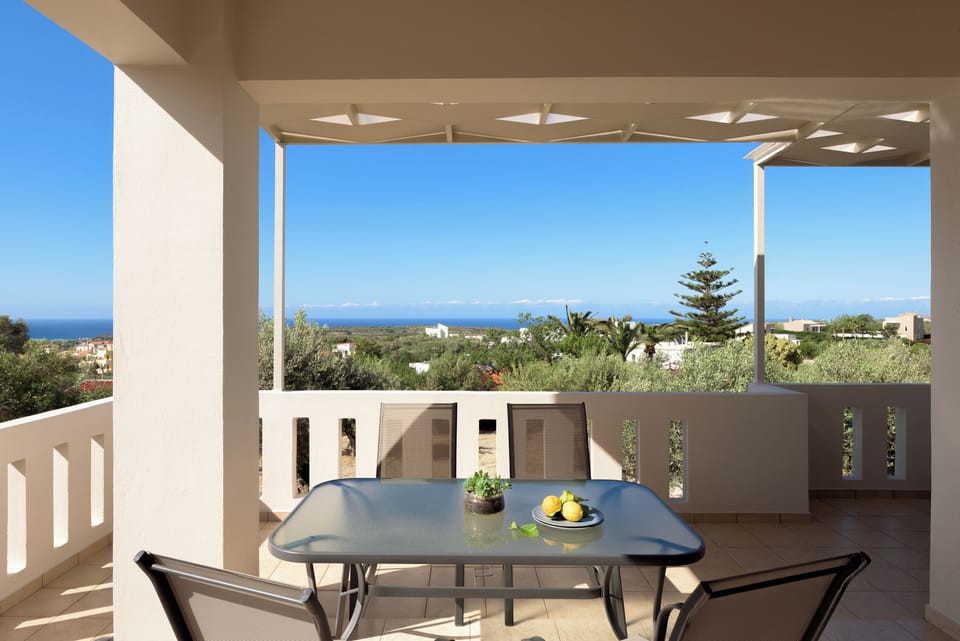 The balcony is equipped with patio furniture.