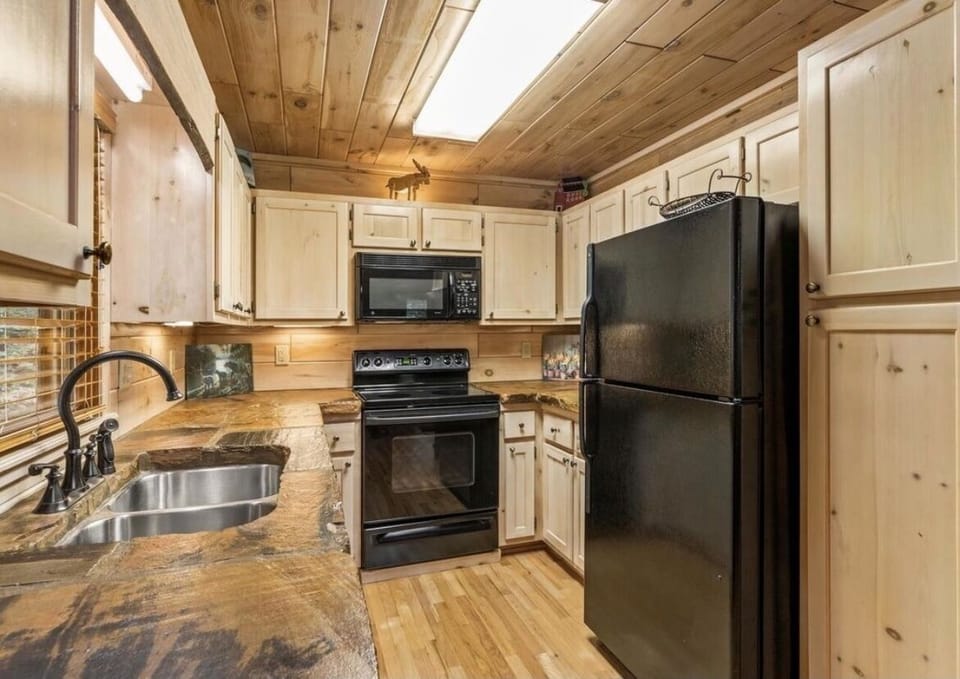 Fully stocked kitchen with stone countertops and everything you need!