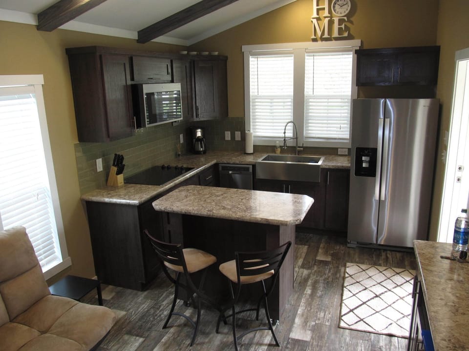 Another view of kitchen with island & chairs.
