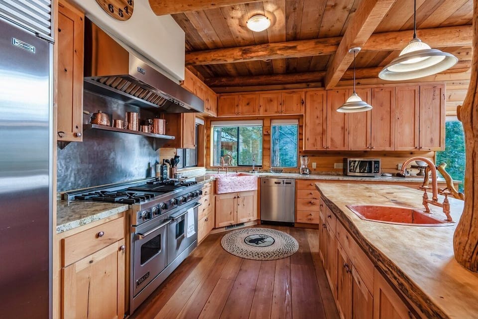 Waterfall Lodge is a tri-level masterpiece. Featuring massive logs, stone pillars, and two gorgeous waterfalls right off one of the three back decks. 