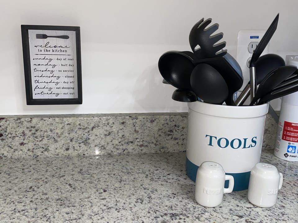 Kitchen tools for use as well as basics - salt/pepper/oil.
