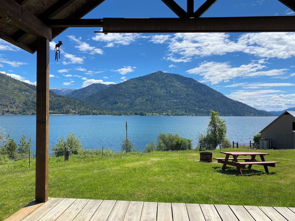 The view of Lake Pend Oreille from the covered porch faces southeast toward Eagan Mountain