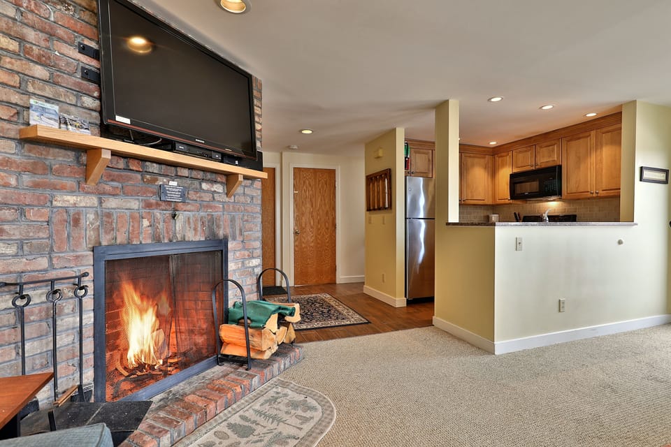 View from the living area to the fully equipped kitchen.