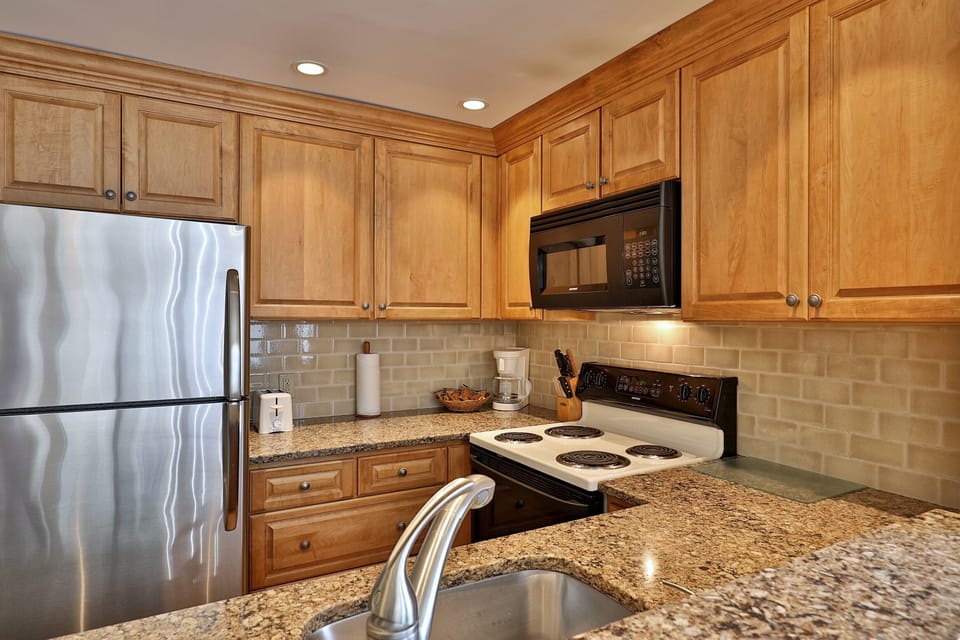 Fully equipped kitchen with granite countertops