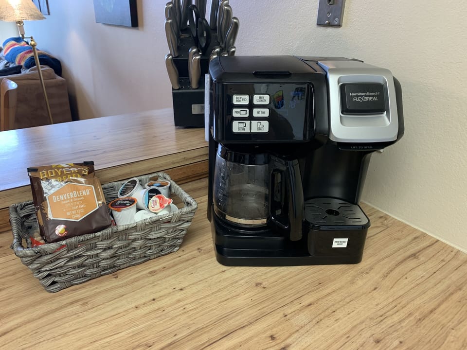 Coffee maker- can make a pot or a cup! With some starter coffee, tea, creamer. 