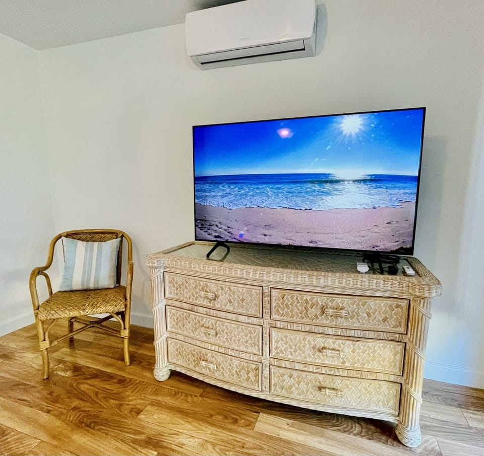 Pool Bedroom - 55' Smart TV, dresser & chair. 