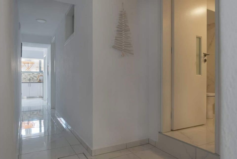 Hallway from the back of the house towards the front 