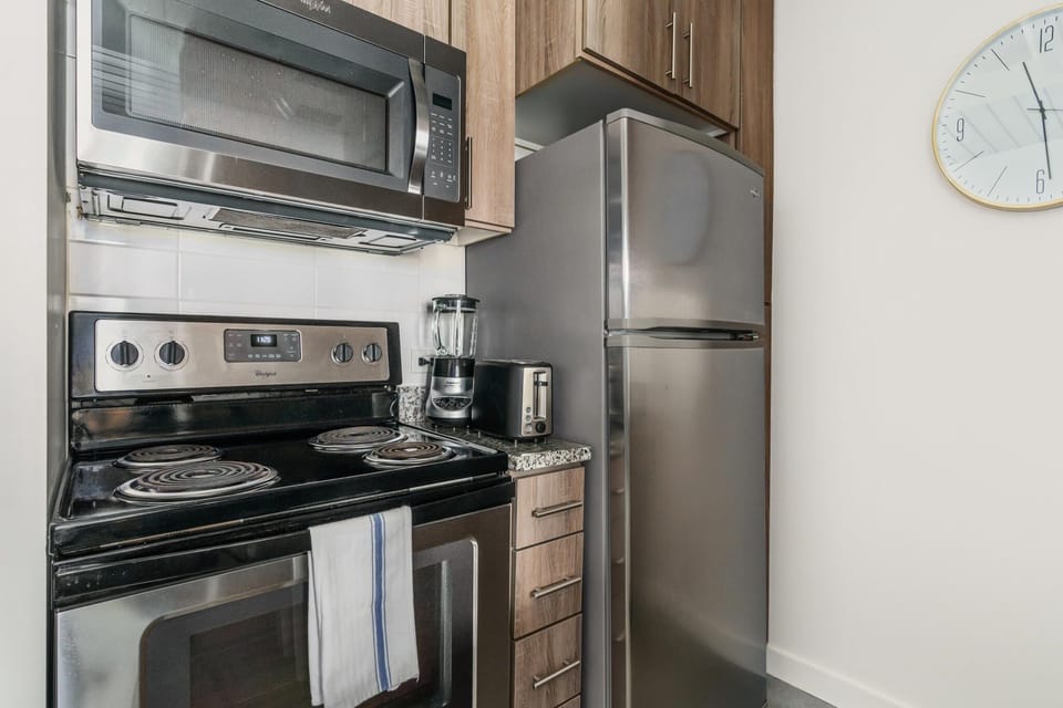 Craft tasty dishes in this contemporary kitchen with all the necessary amenities.